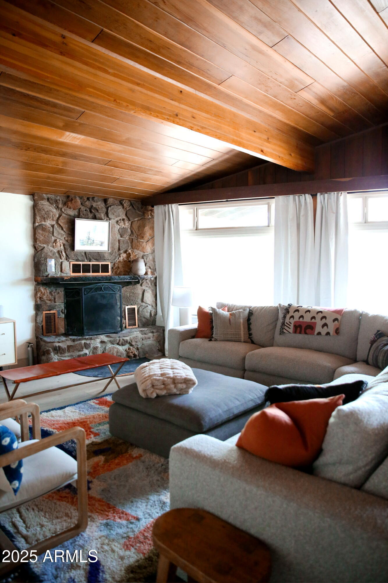480 Cochise Road Munds Park, AZ 86017 - Photo 8 of 62 a living room with furniture a fireplace and a window