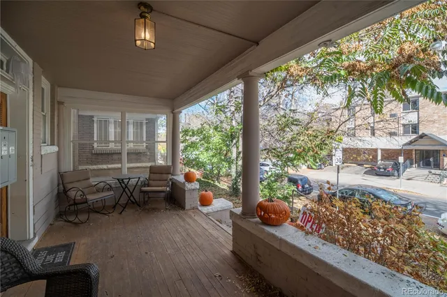 a living room filled with furniture and a large window