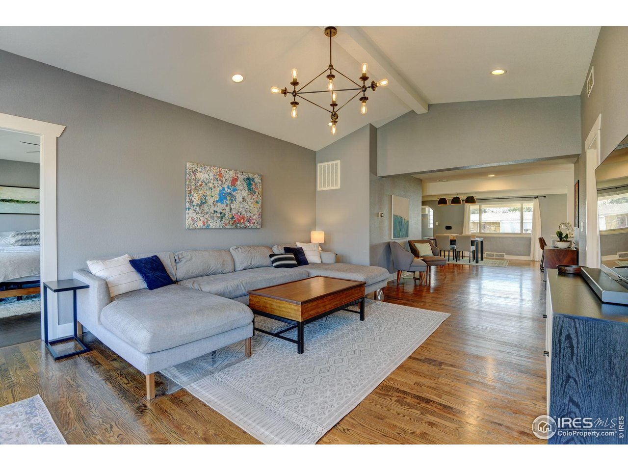 1150 Eudora Street Denver, CO 80220 - Photo 18 of 39 a living room with furniture and wooden floor