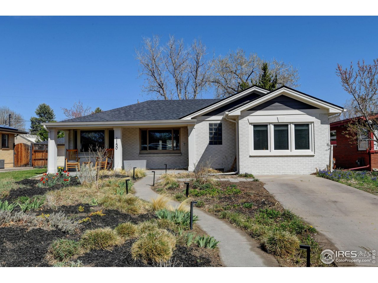 1150 Eudora Street Denver, CO 80220 - Photo 2 of 39 a front view of a house with garden