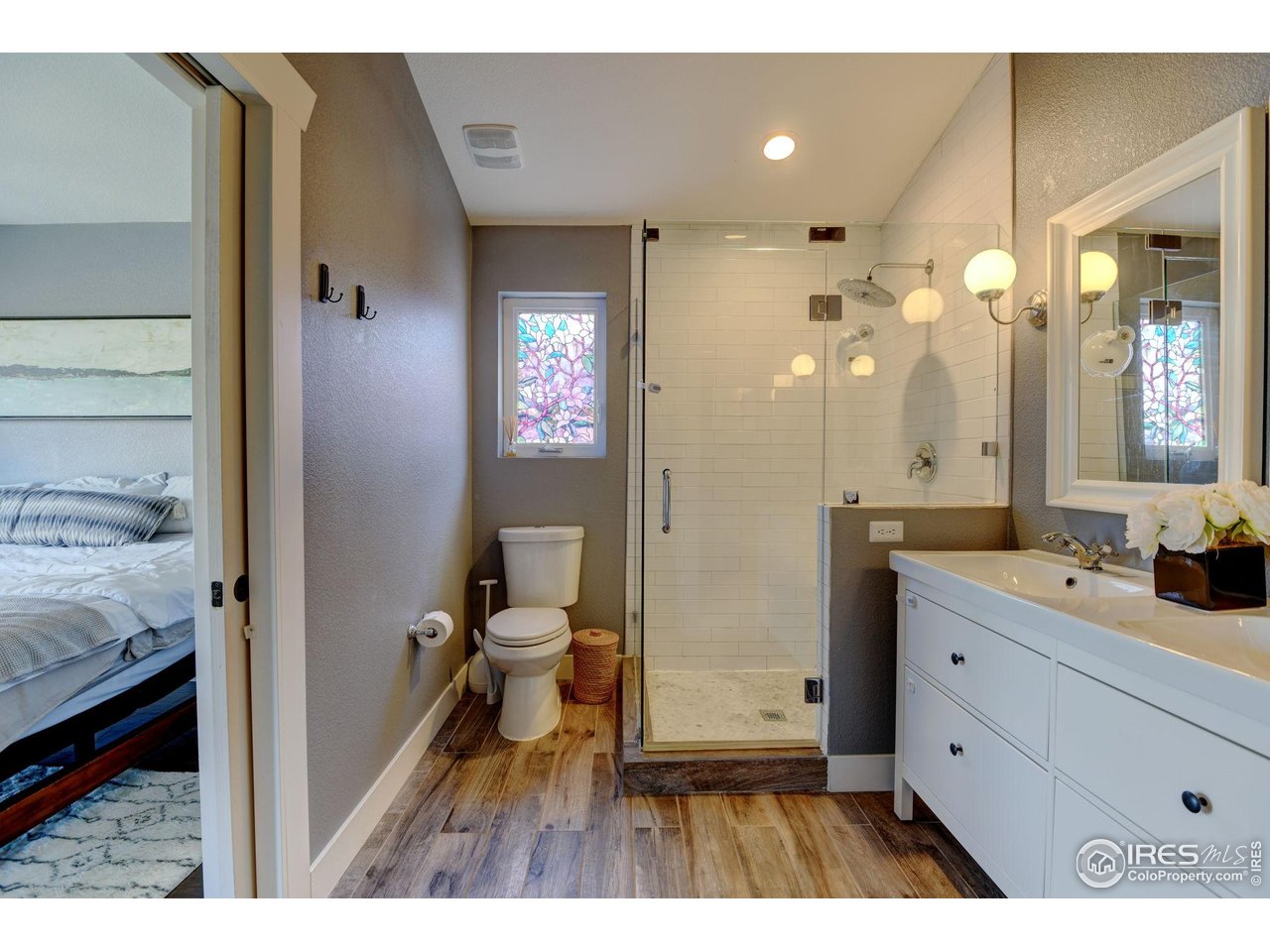 1150 Eudora Street Denver, CO 80220 - Photo 26 of 39 a bathroom with a sink a toilet and a mirror
