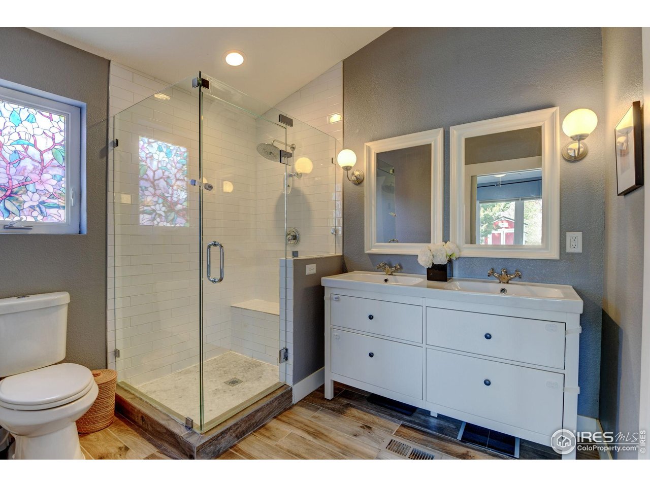 1150 Eudora Street Denver, CO 80220 - Photo 27 of 39 a bathroom with a double vanity sink mirror and toilet