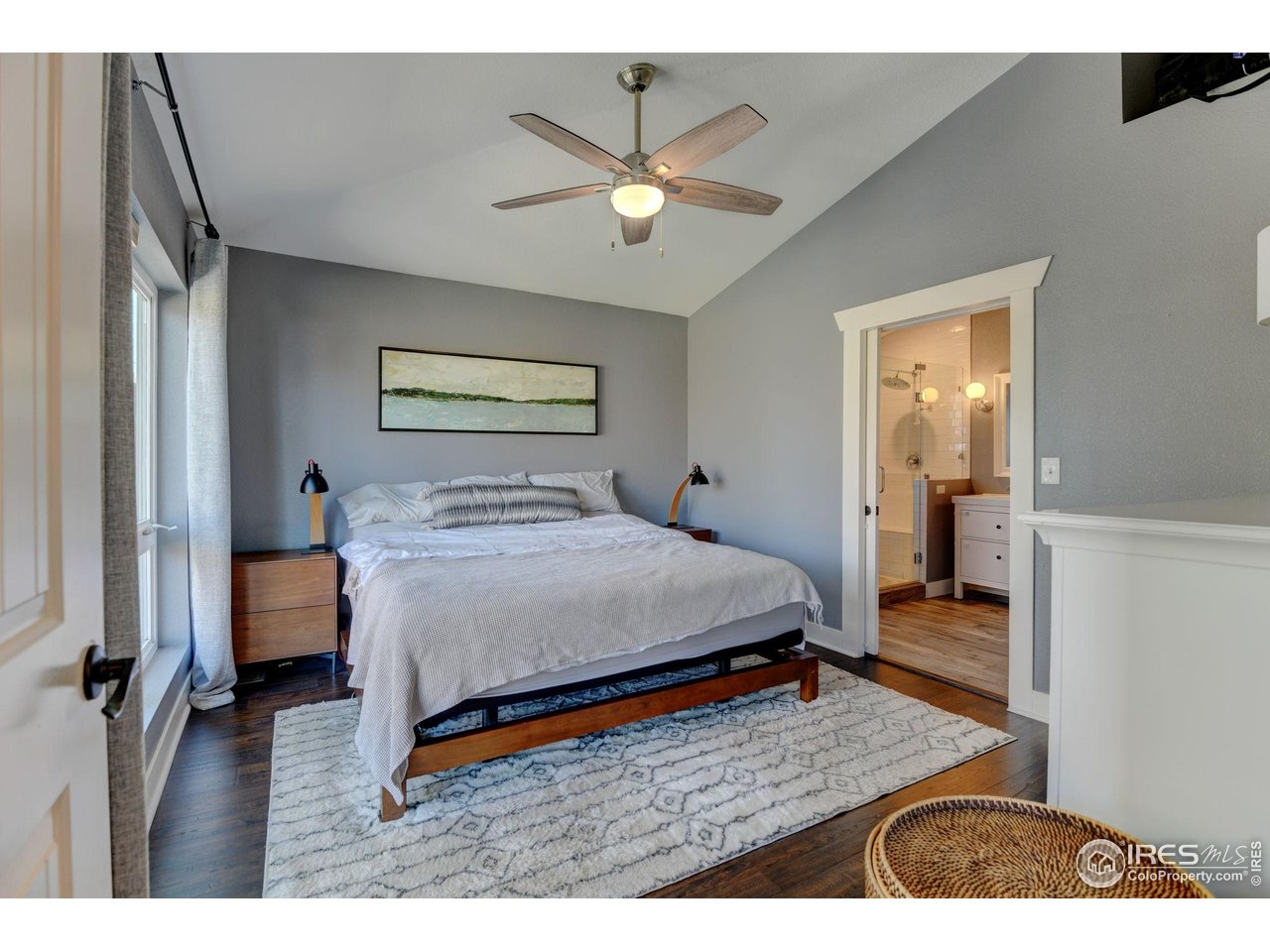 1150 Eudora Street Denver, CO 80220 - Photo 29 of 39 a bedroom with a bed and a chandelier