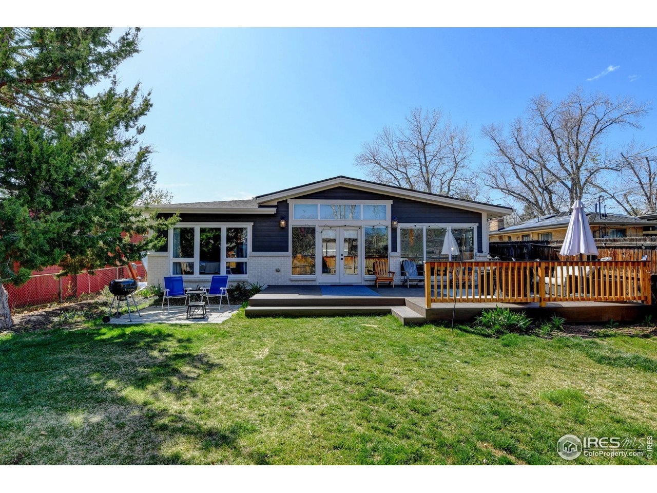 1150 Eudora Street Denver, CO 80220 - Photo 38 of 39 a view of a house with a yard and sitting area