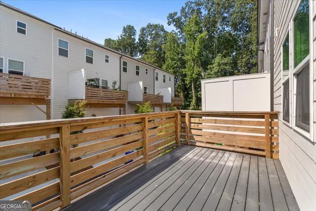 an aerial view of a house with a yard basket ball court and outdoor seating