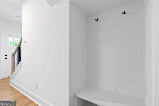 a large kitchen with granite countertop a large counter top stainless steel appliances and cabinets