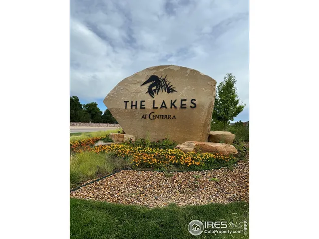 a view of house with mountains in the background