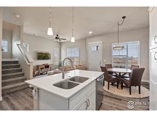 a view of kitchen with cabinets table and chairs