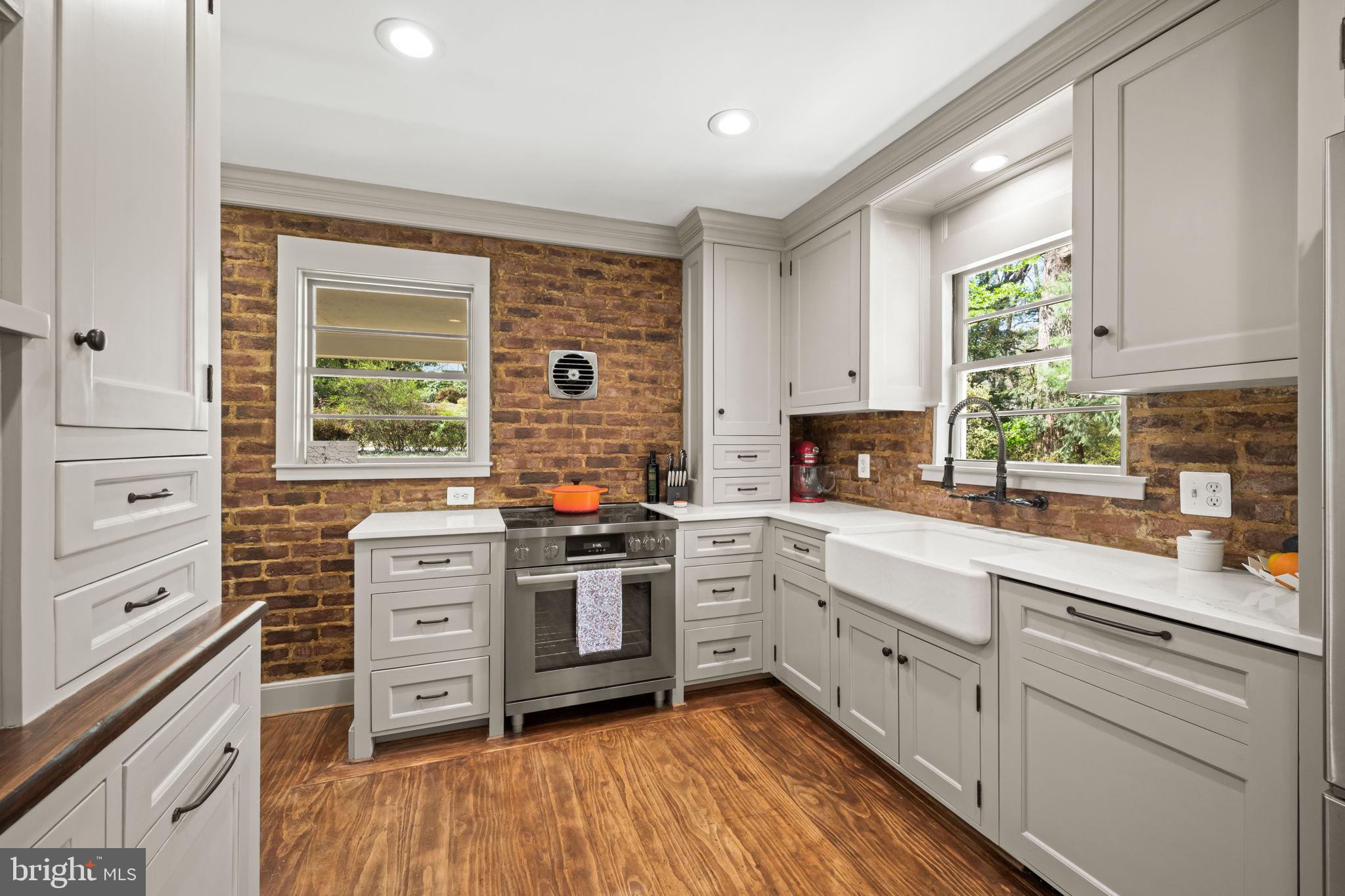 3814 Hillcrest Lane Annandale, VA 22003 - Photo 12 of 48 a kitchen with white cabinets and appliances