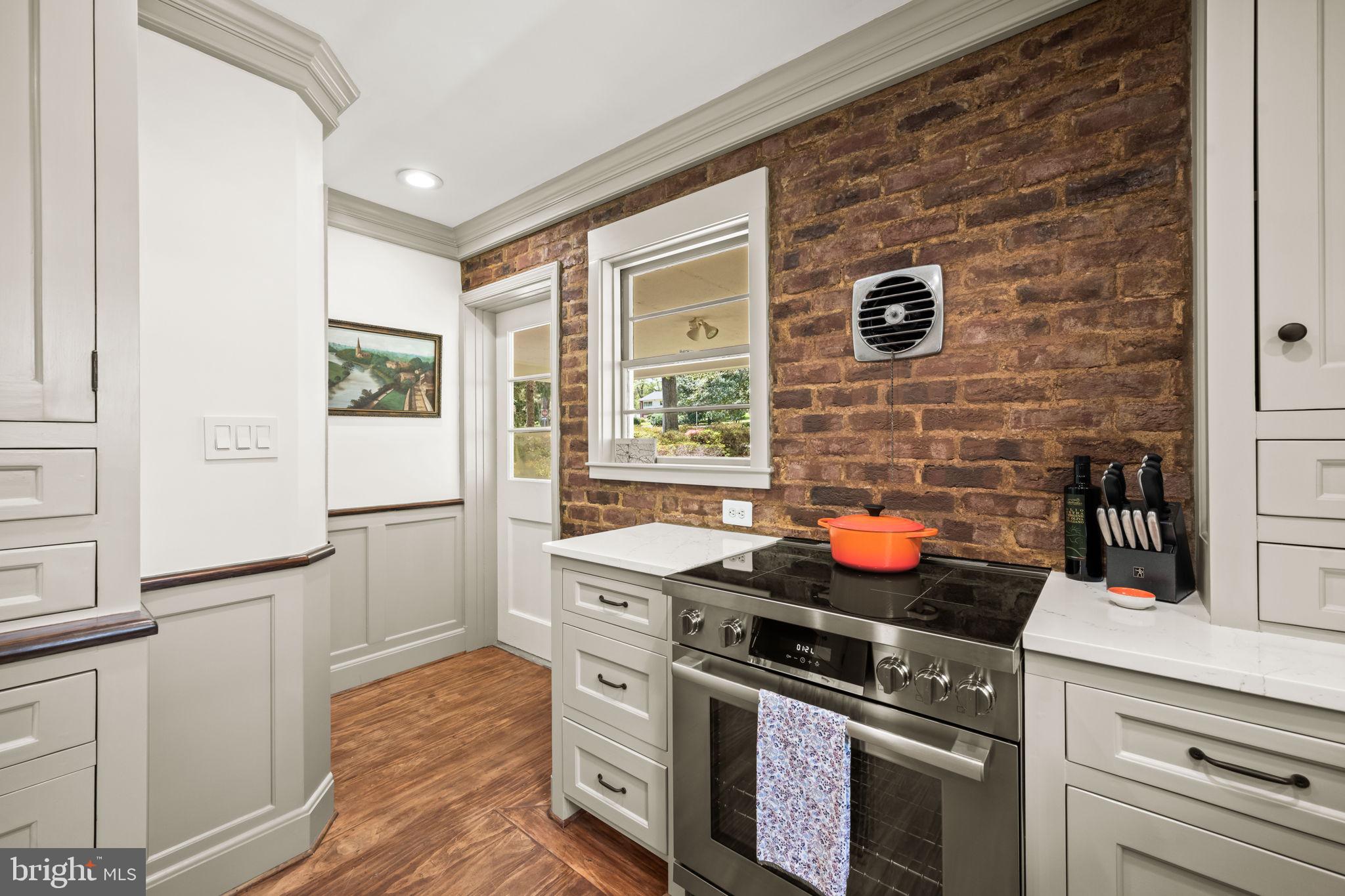 3814 Hillcrest Lane Annandale, VA 22003 - Photo 15 of 48 a kitchen with stainless steel appliances and a stove top oven