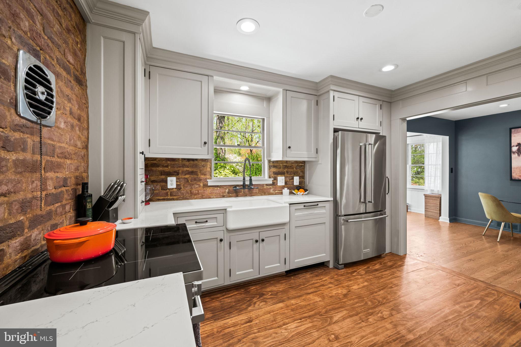 3814 Hillcrest Lane Annandale, VA 22003 - Photo 16 of 48 a kitchen with stainless steel appliances a refrigerator sink and cabinets