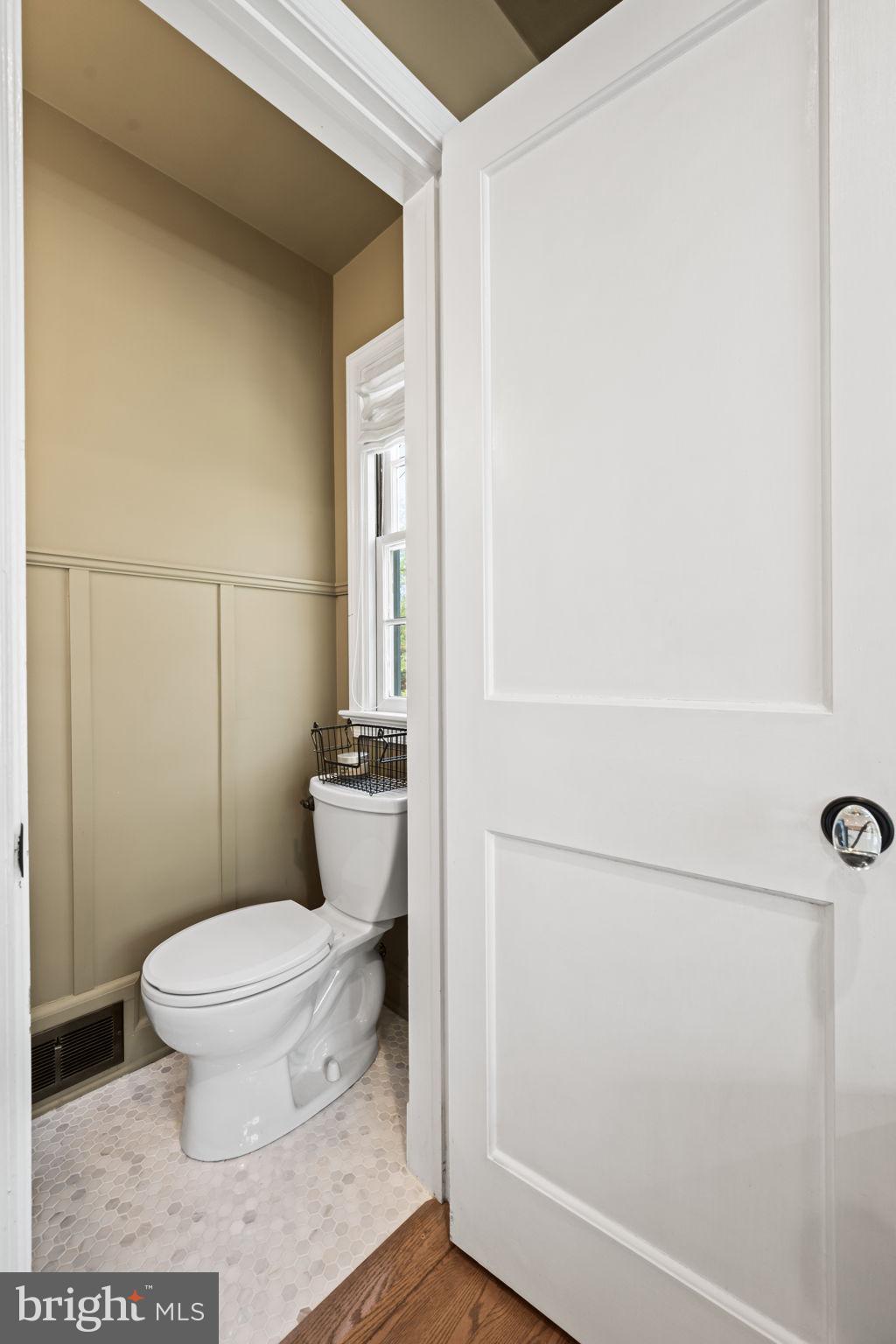 3814 Hillcrest Lane Annandale, VA 22003 - Photo 26 of 48 a white toilet sitting next to a bathroom sink