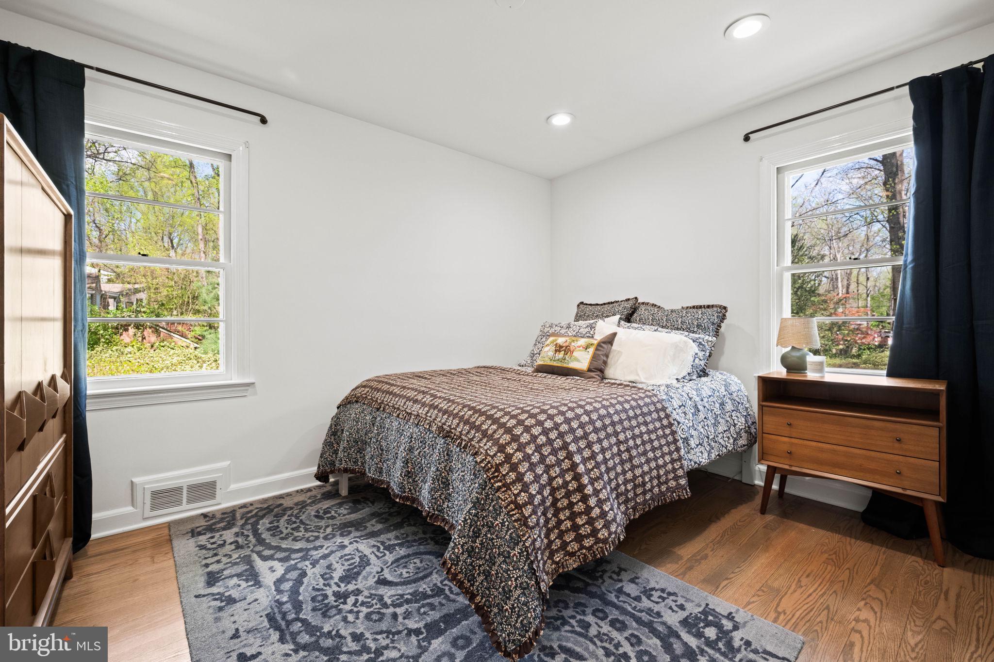 3814 Hillcrest Lane Annandale, VA 22003 - Photo 27 of 48 a bedroom with a bed and wooden floor