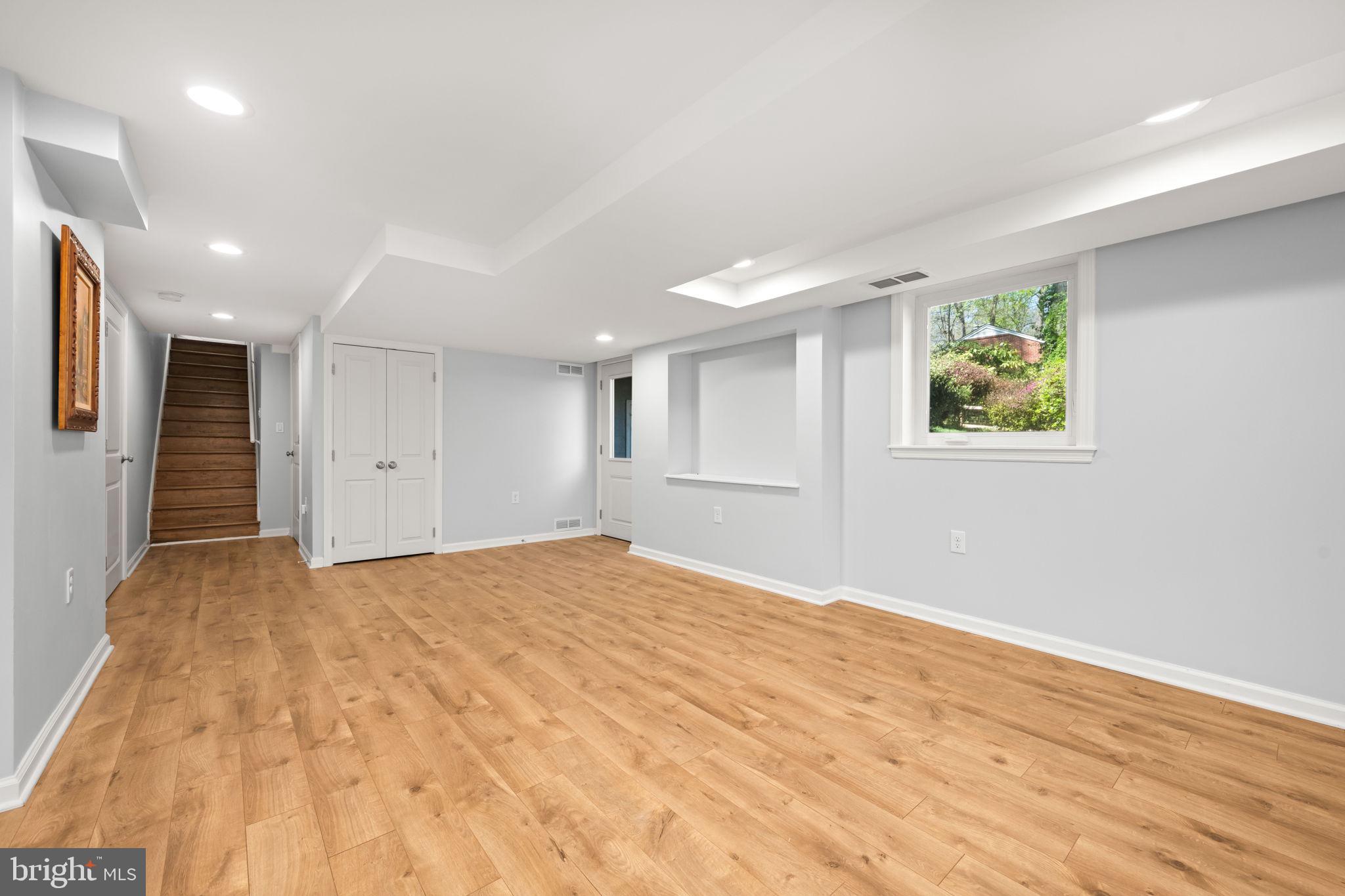 3814 Hillcrest Lane Annandale, VA 22003 - Photo 31 of 48 a view of an empty room with wooden floor and a window