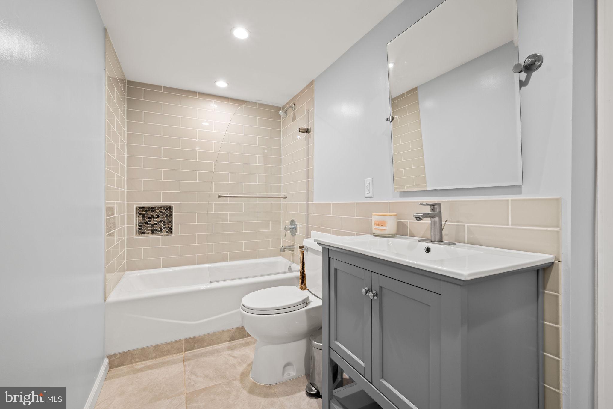 3814 Hillcrest Lane Annandale, VA 22003 - Photo 35 of 48 a bathroom with a sink toilet and shower