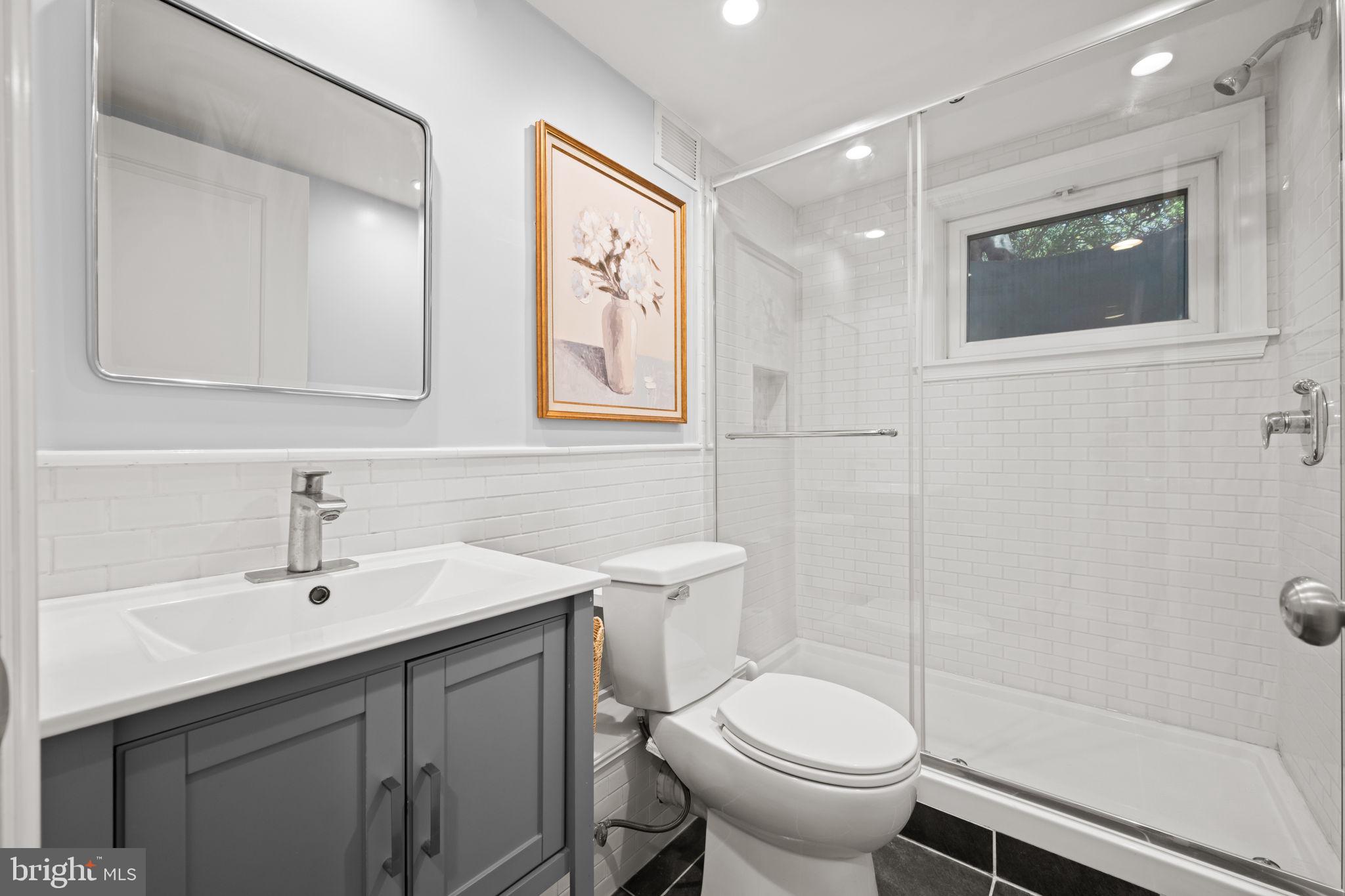 3814 Hillcrest Lane Annandale, VA 22003 - Photo 37 of 48 a bathroom with a sink toilet and shower