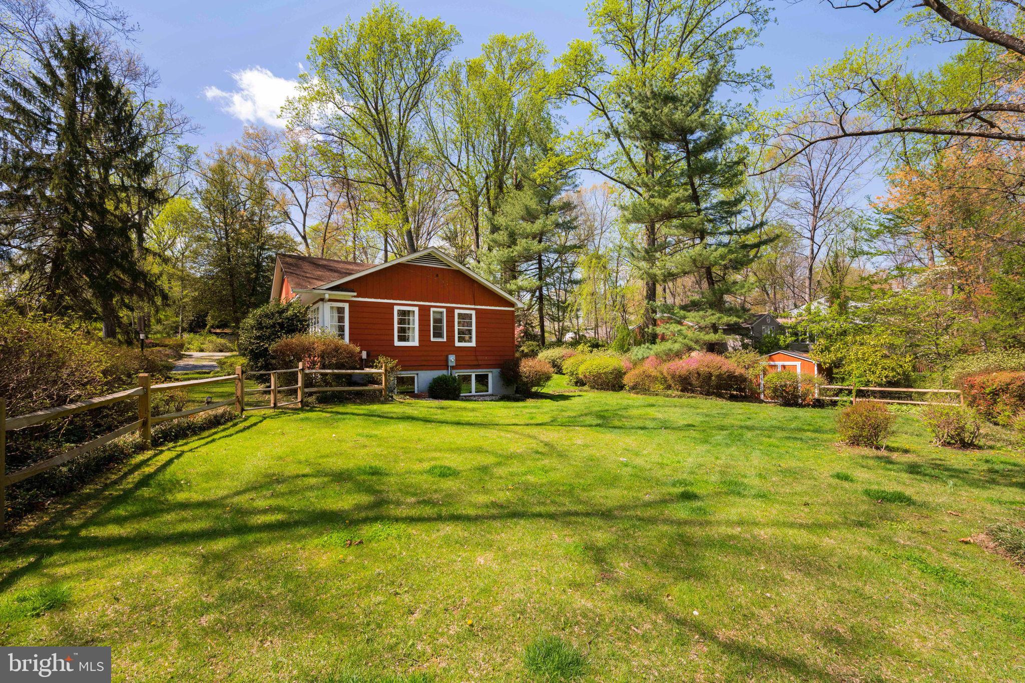 3814 Hillcrest Lane Annandale, VA 22003 - Photo 42 of 48 a front view of a house with a yard table and chairs