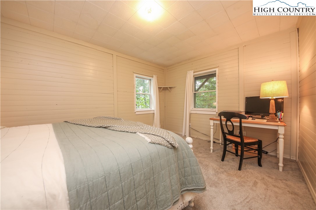 2171 Junaluska Road Boone, NC 28607 - Photo 23 of 46 a bedroom with a bed and a table