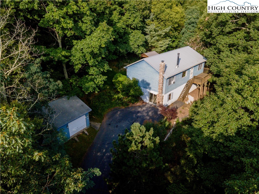 2171 Junaluska Road Boone, NC 28607 - Photo 29 of 46 an aerial view of a house with a yard and garden