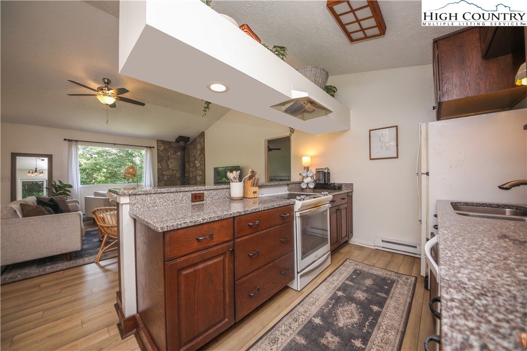 2171 Junaluska Road Boone, NC 28607 - Photo 3 of 46 a kitchen with a stove and a sink