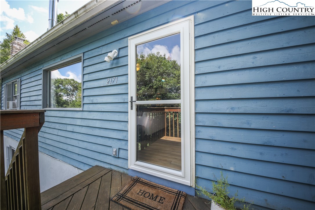 2171 Junaluska Road Boone, NC 28607 - Photo 42 of 46 a view of a house with a door and wooden floor