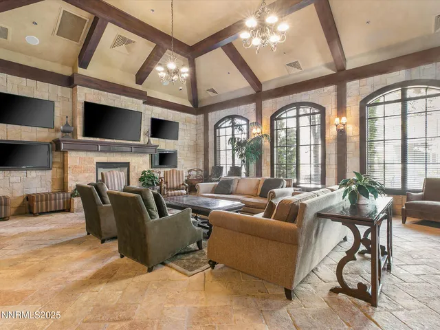 an aerial view of residential houses with outdoor space and swimming pool