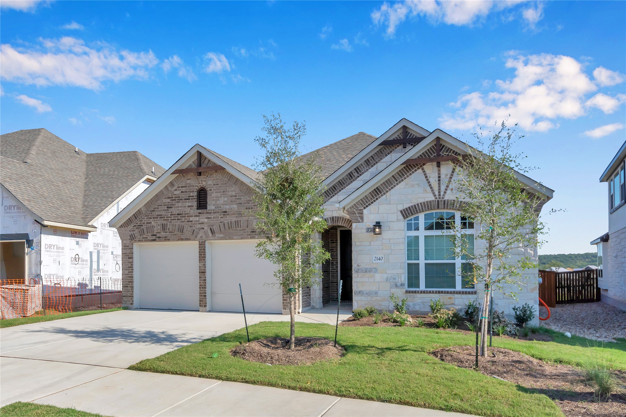 2140 Base Burner Path Leander, TX 78641 - Photo 2 of 27 a front view of a house with a yard and garage