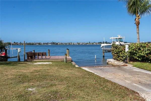 a view of a garden with an ocean view