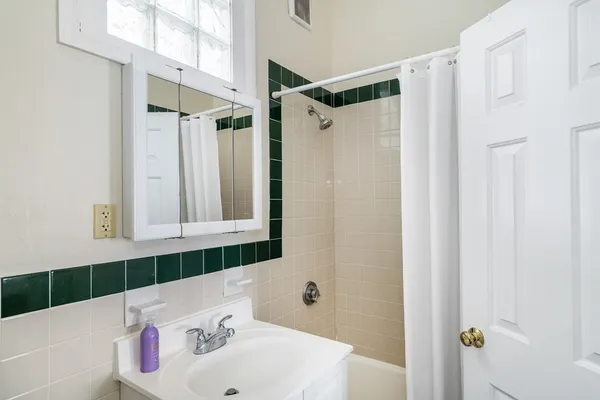 a bathroom with a sink and a shower