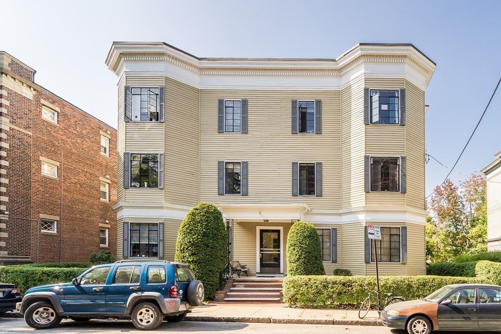 15 Ellery Street, Unit 11 Cambridge, MA 02138 - Photo 21 of 22 a front view of a house with a yard