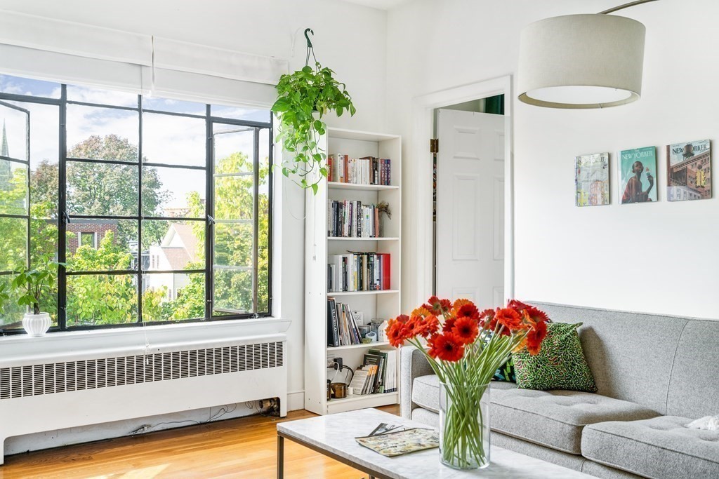 15 Ellery Street, Unit 11 Cambridge, MA 02138 - Photo 3 of 22 a living room with furniture and flowers