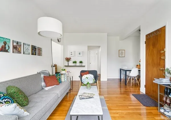 a living room with furniture and a table