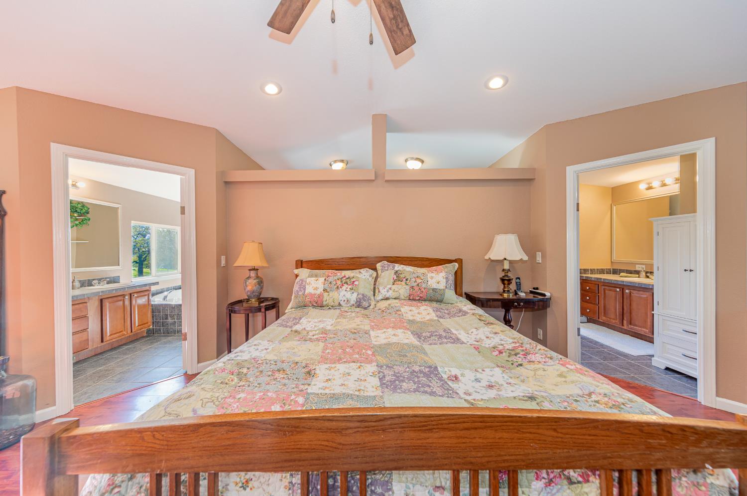 3335 Wildcat Road Mariposa, CA 95338 - Photo 27 of 48 a large bedroom with a bed and wooden floor