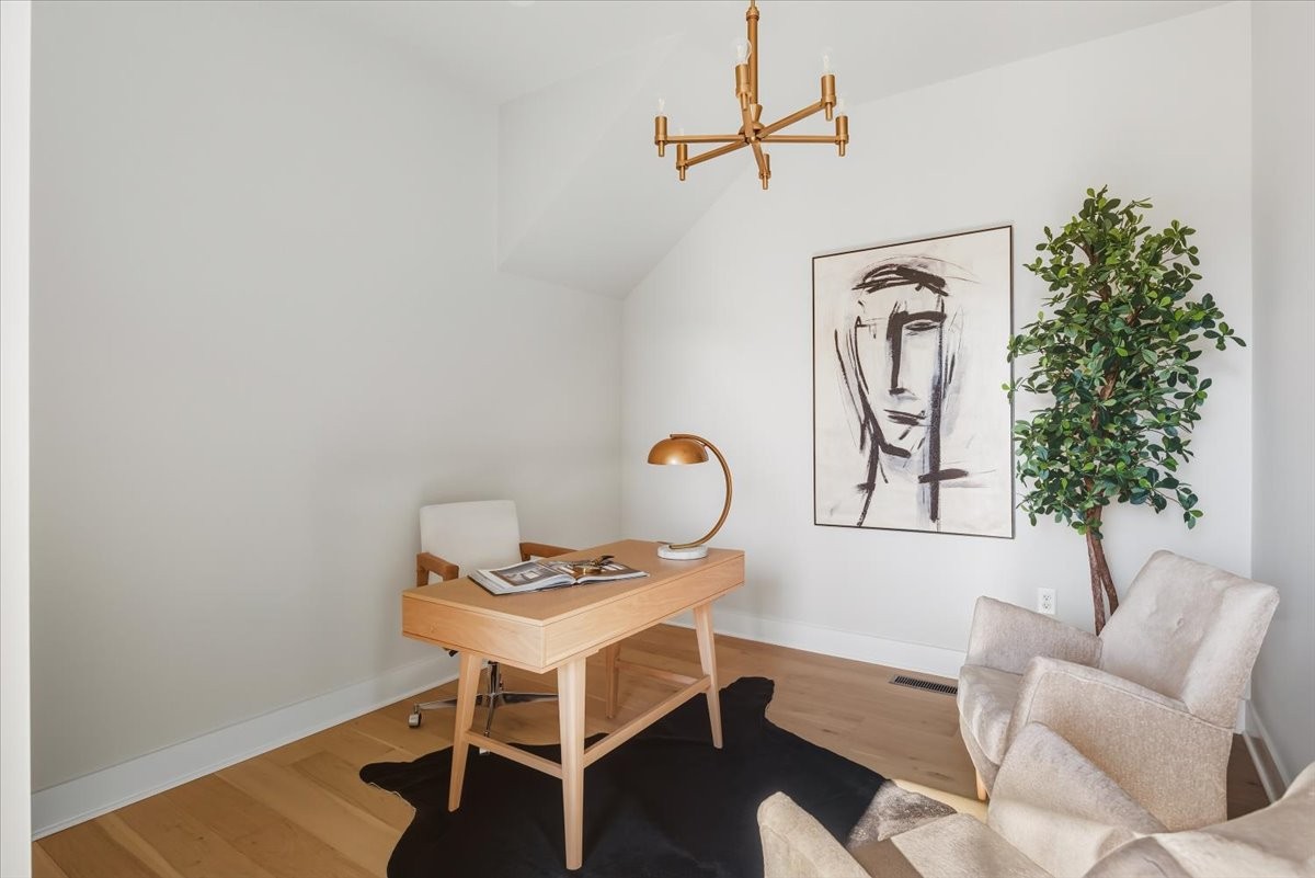 1902 3rd Avenue North, Unit B Nashville, TN 37208 - Photo 24 of 47 a living room with furniture a rug and a potted plant