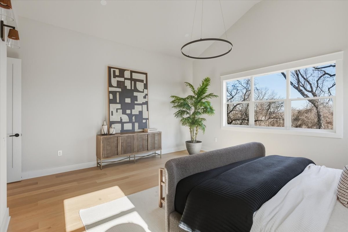 1902 3rd Avenue North, Unit B Nashville, TN 37208 - Photo 38 of 47 a bedroom with a large bed and a potted plant