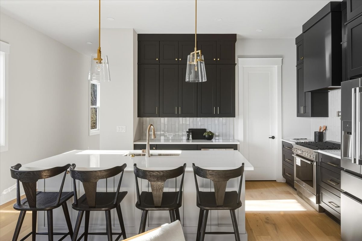 1902 3rd Avenue North, Unit B Nashville, TN 37208 - Photo 8 of 47 a view of a dining room with furniture and wooden floor