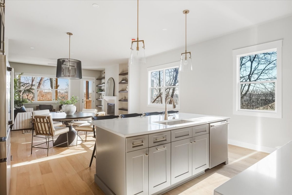 1902 3rd Avenue North, Unit B Nashville, TN 37208 - Photo 10 of 47 a very nice looking kitchen with granite countertop a stove a sink a window and dining table