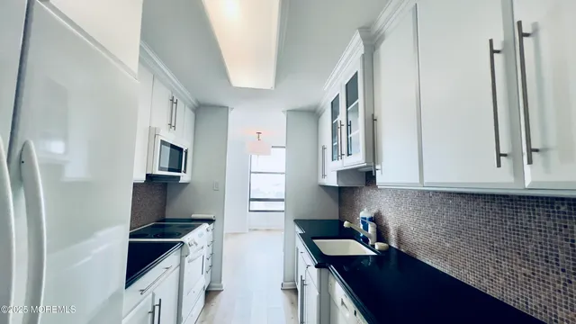 a bedroom with furniture and a closet