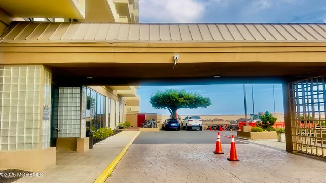 a view of a cars park in front of a building