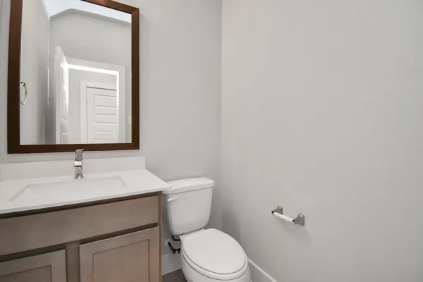 a large kitchen with granite countertop lots of counter space and sink