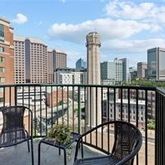 a view of a balcony with city view