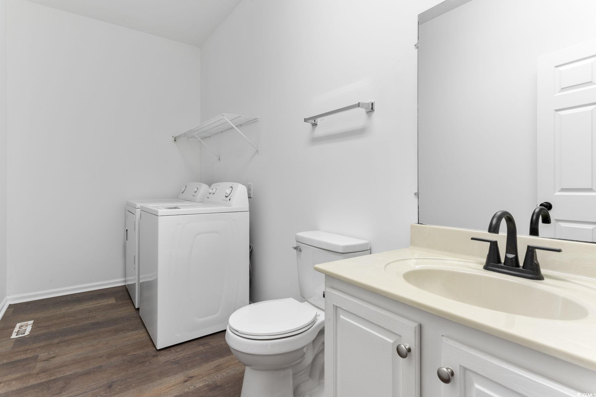 2321 Brick Drive Longs, SC 29568 - Photo 27 of 40 Bathroom with independent washer and dryer, dark wood-type flooring, and vanity