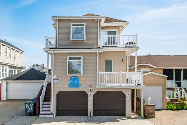 a front view of a house with parking space