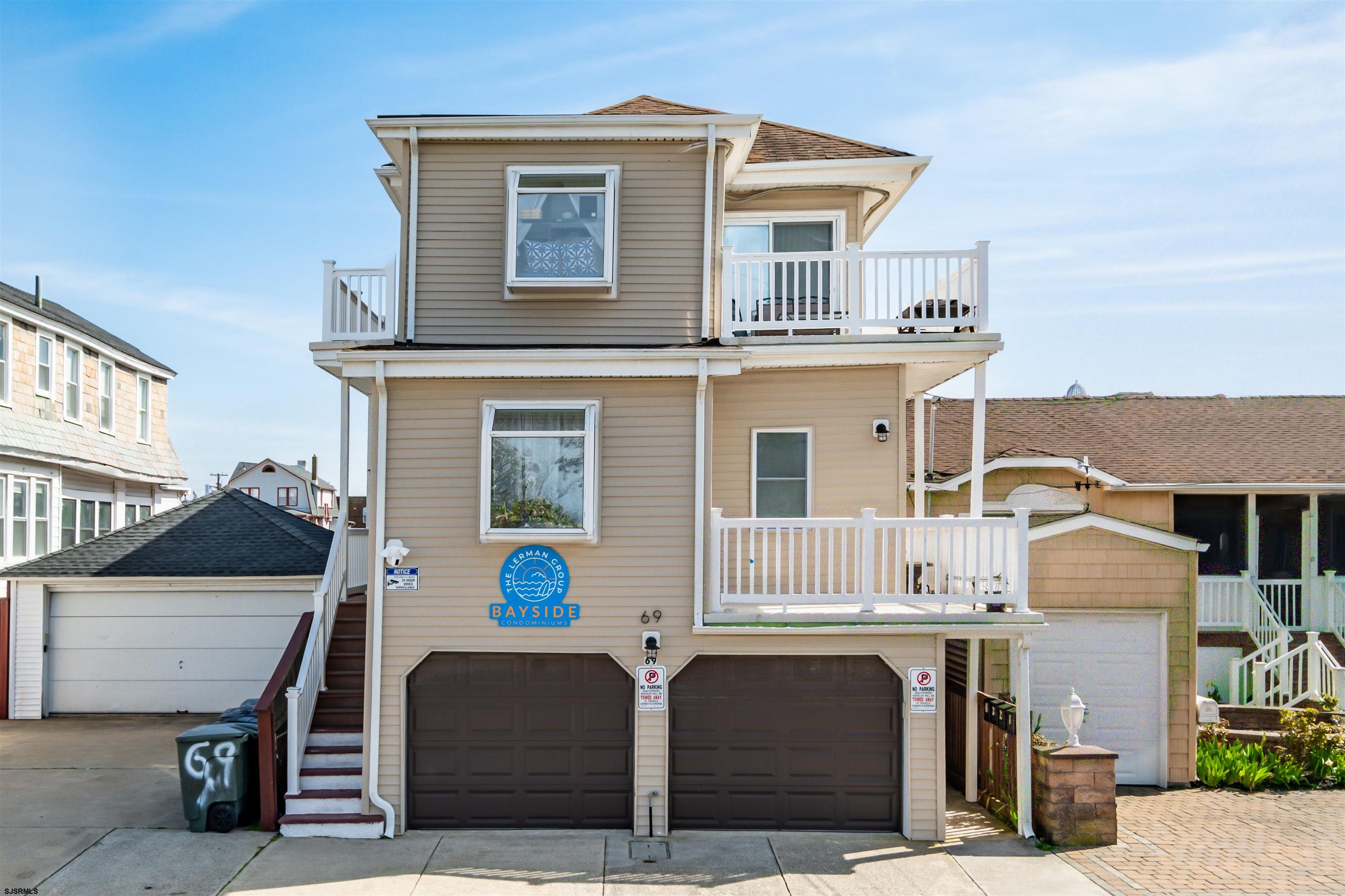 a front view of a house with parking space
