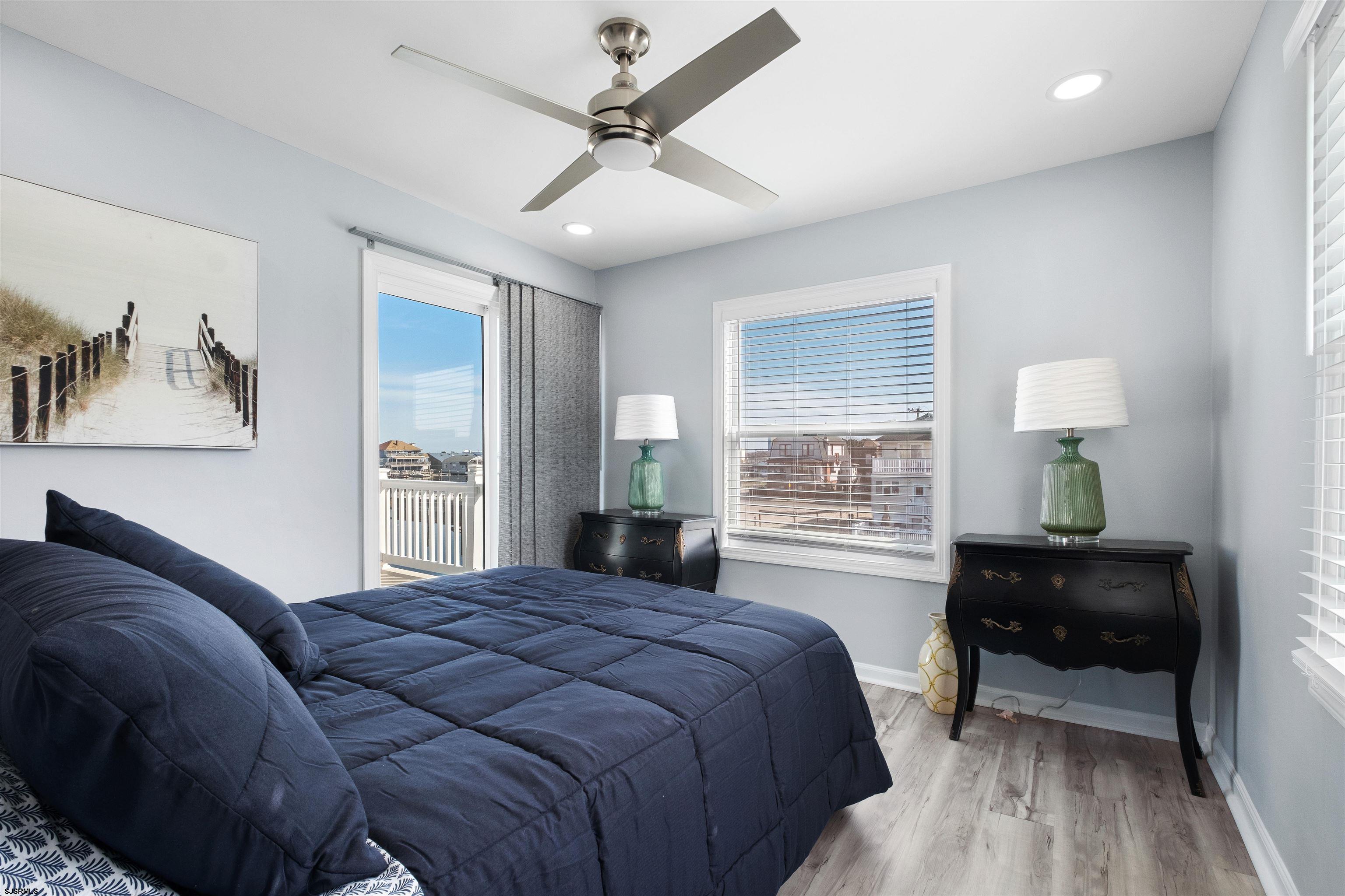 69 North Harrisburg Avenue, Unit 4 Atlantic City, NJ 08401 - Photo 20 of 25 a bedroom with a bed and wooden floor