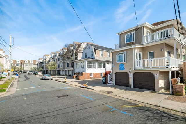 a view of a building with car parked