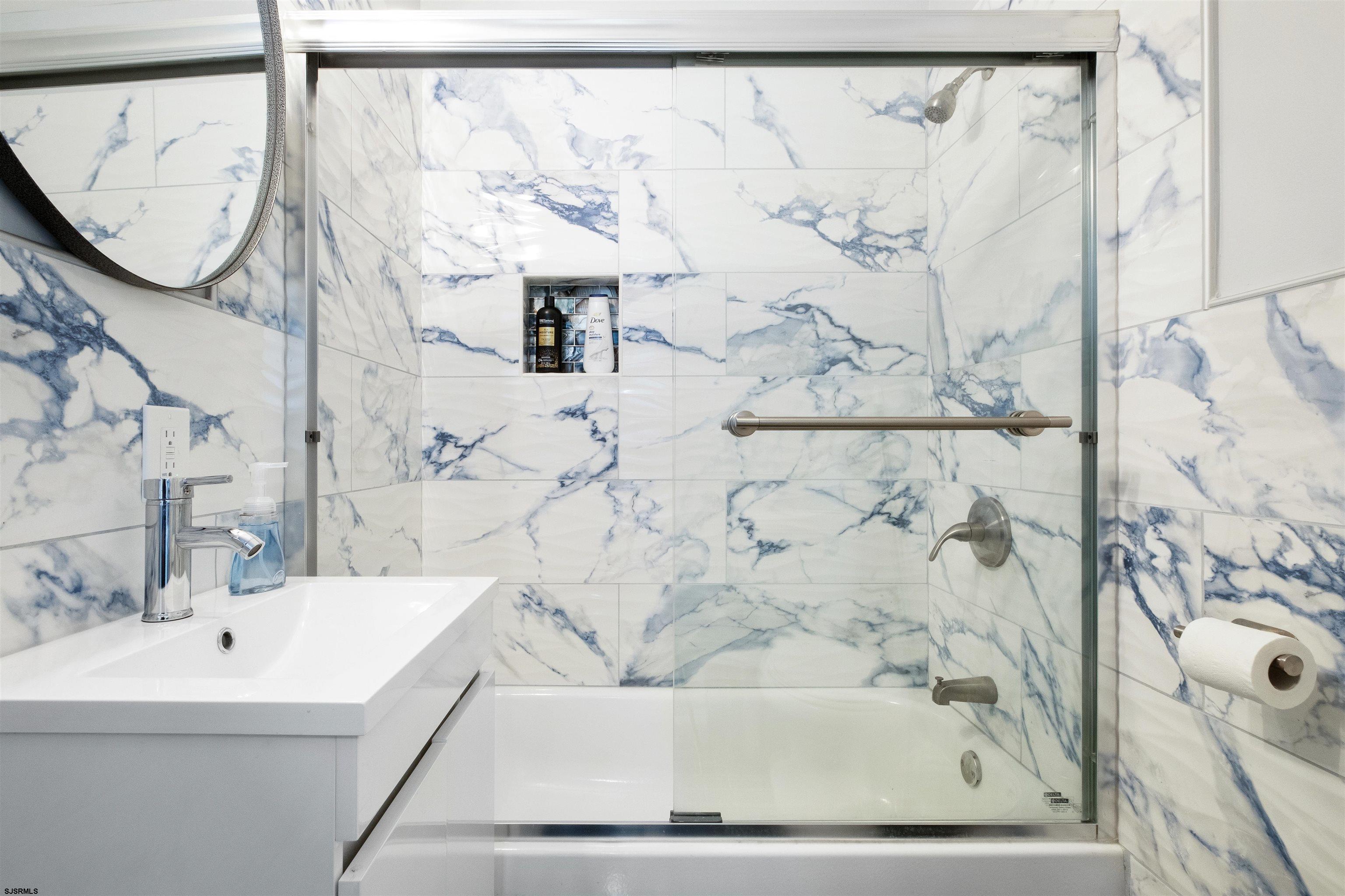 69 North Harrisburg Avenue, Unit 4 Atlantic City, NJ 08401 - Photo 24 of 25 a bathroom with a bathtub and shower