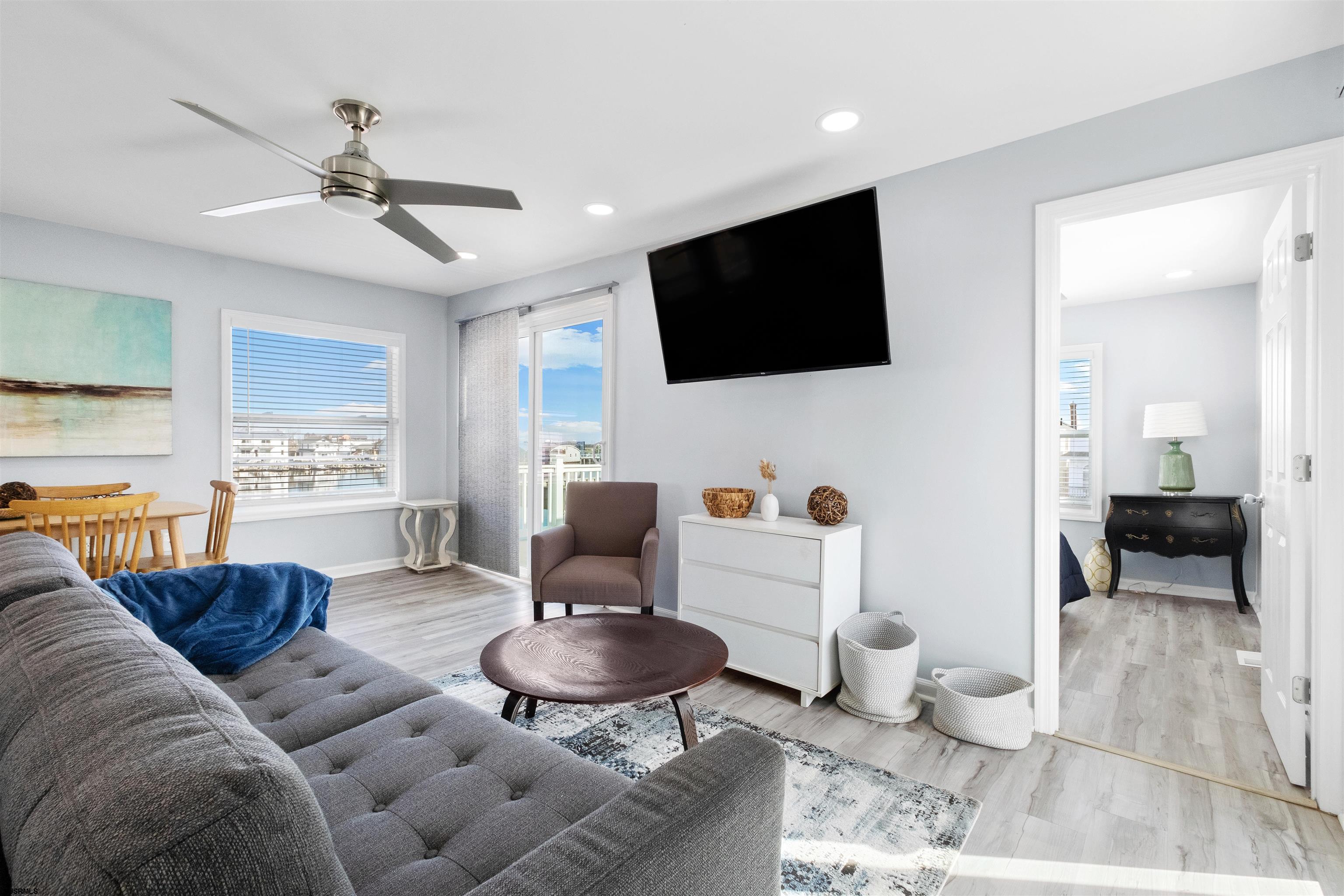 69 North Harrisburg Avenue, Unit 4 Atlantic City, NJ 08401 - Photo 7 of 25 a living room with furniture and a flat screen tv