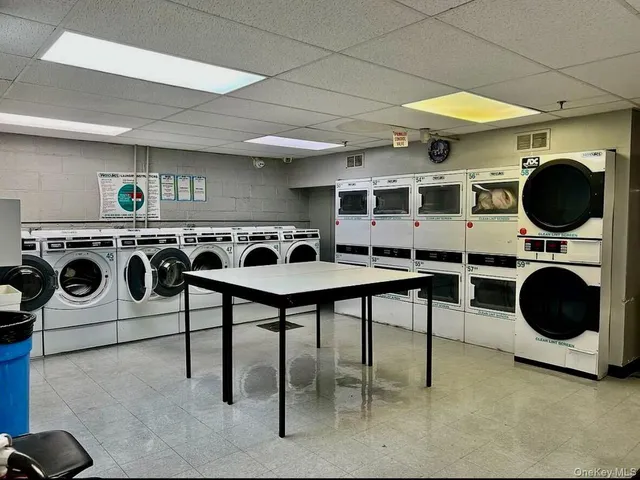 a kitchen with a stove a washer and dryer