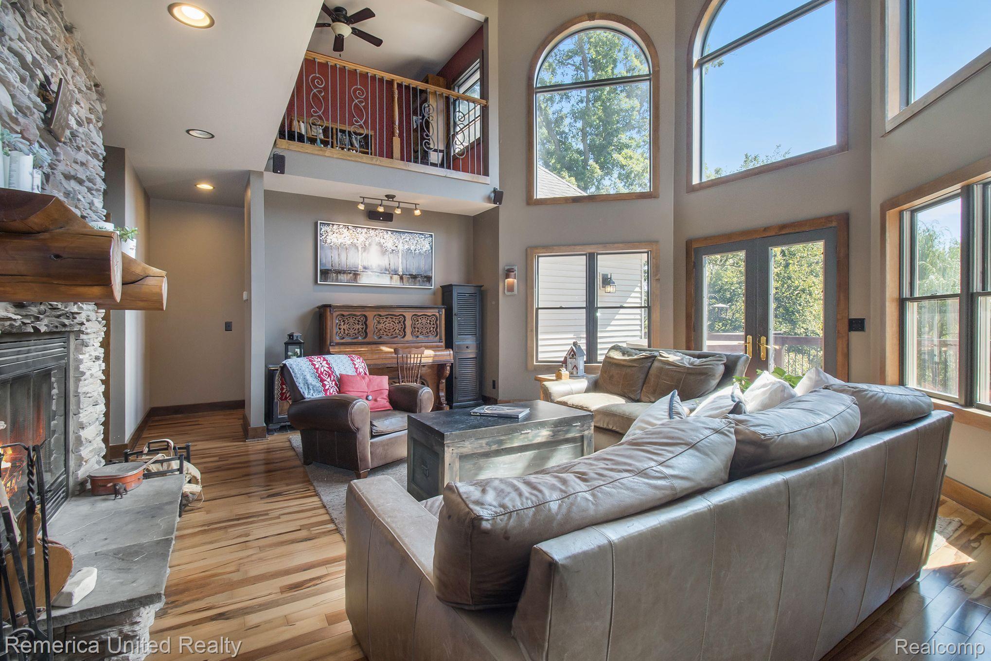 3470 East Highland Road Howell, MI 48843 - Photo 22 of 66 Great Room & Door to Deck